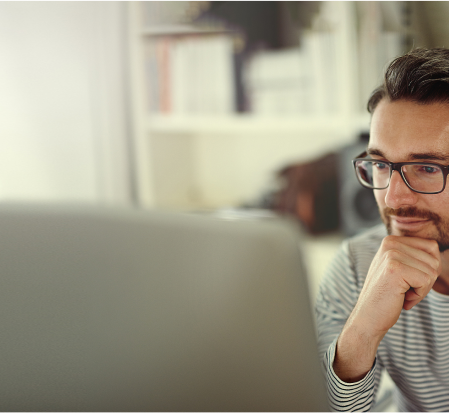 Male reviewing resources on laptop, not actual Serostim® patient