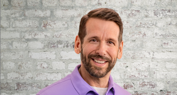 Middle-aged white male in purple collared shirt, not actual Serostim® patient