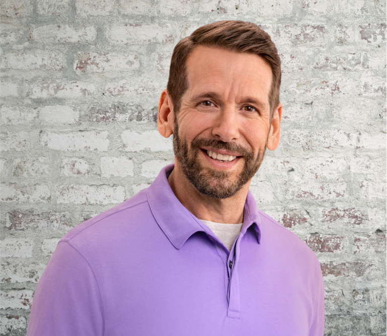 Middle-aged white male in purple collared shirt, not actual Serostim® patient