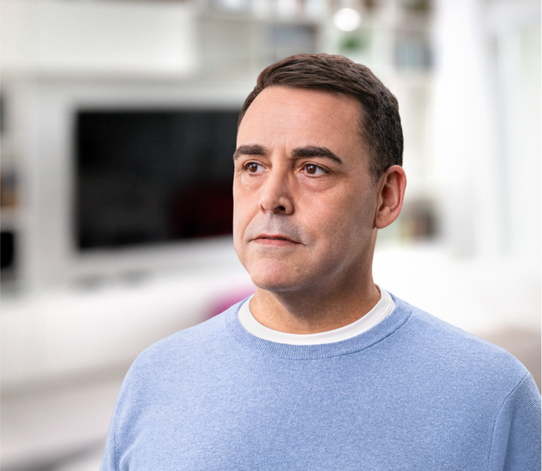 White male in a blue sweater, not actual Serostim® patient